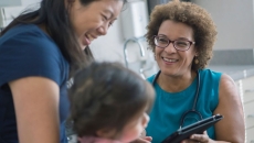 pediatrician with child and caregiver