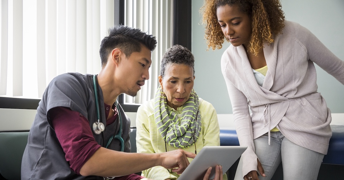 
  Healthcare provider consulting with a patient and family member
