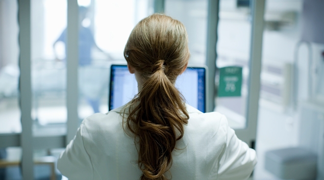 Clinician at computer screen