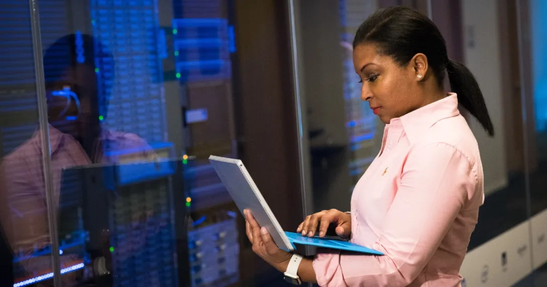IT checks info on laptop in front of IT room IT checks info on laptop in front of IT room