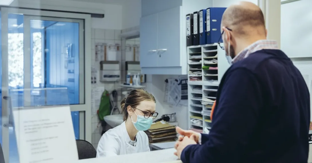 Healthcare professional interacting with patient
Healthcare professional interacting with patient